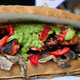 A giant torta that includes chicken, turkey, ham, shrimp, octopus, avocado and mole. (Photo: Ronaldo Schemidt/AFP/GettyImages)